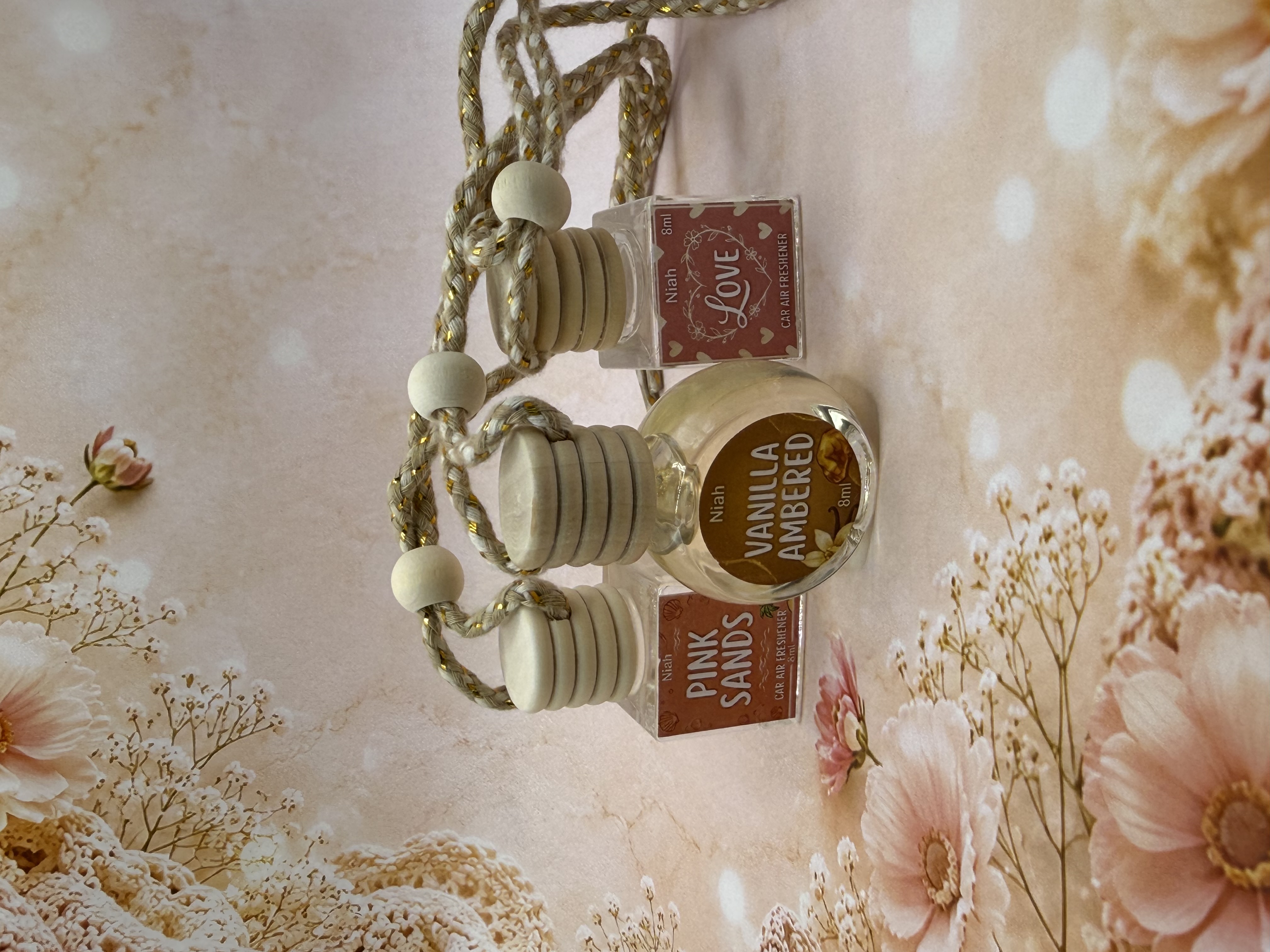 Niah Naturals handmade car air freshener collection — Pink Sands, Vanilla Ambered, and Love