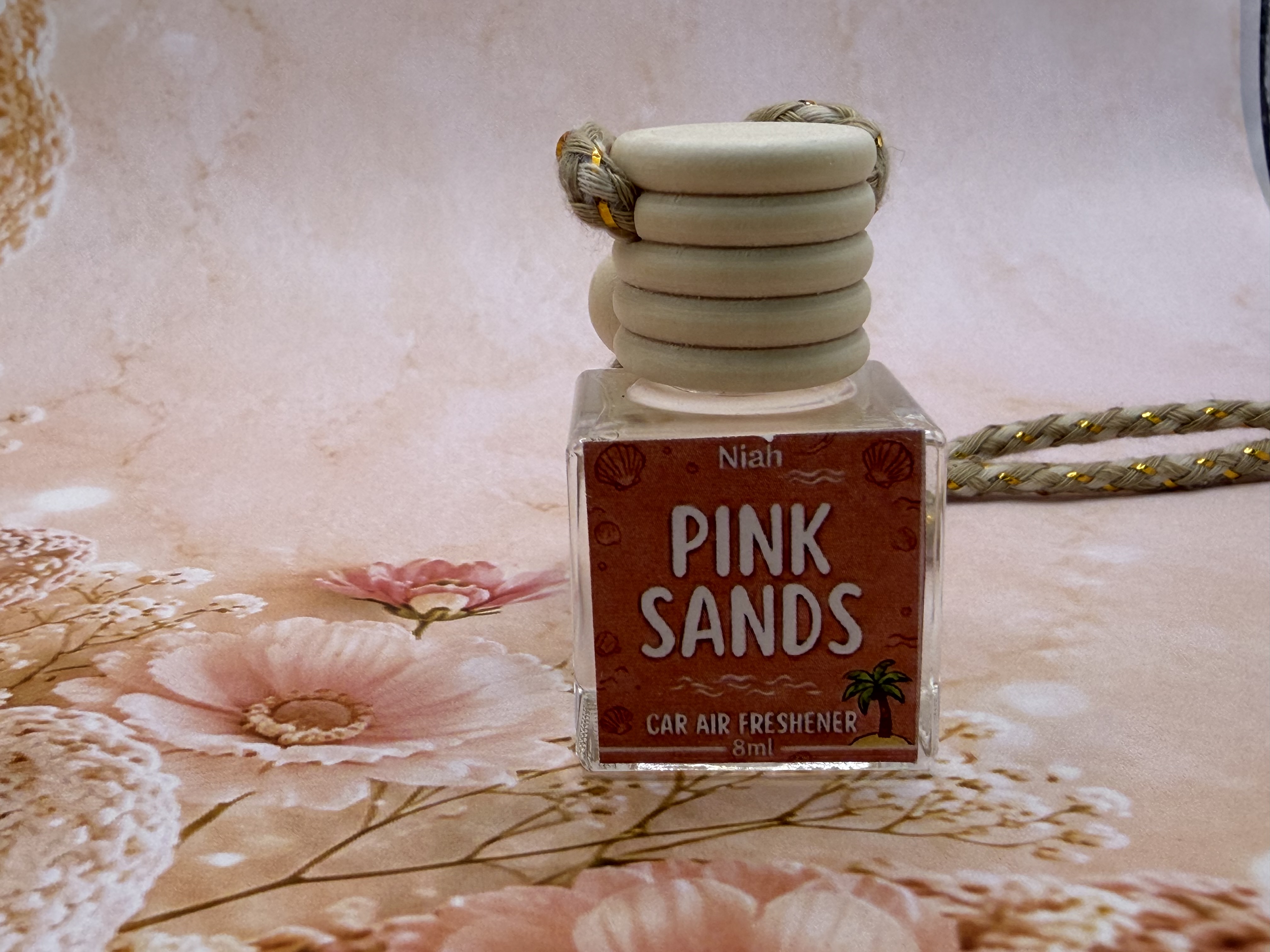 Pink Sands handmade car hanging air freshener by Niah Naturals — warm tropical beach scent